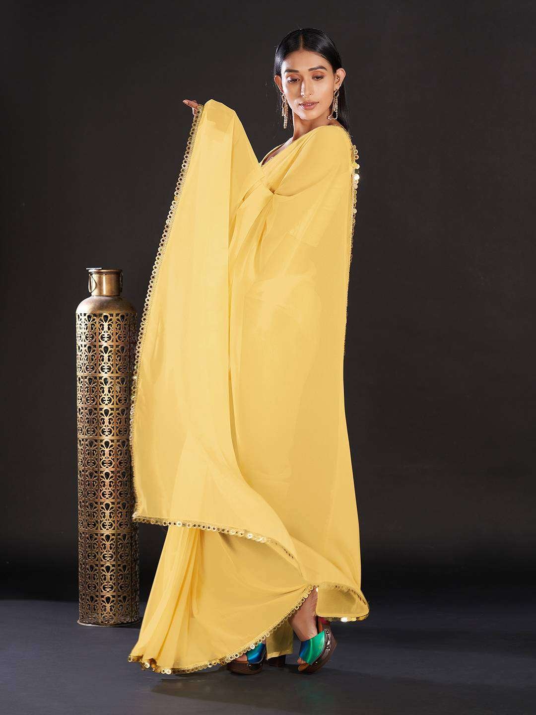 Georgette Yellow Solid And Embellished Designer Saree With Blouse Piece