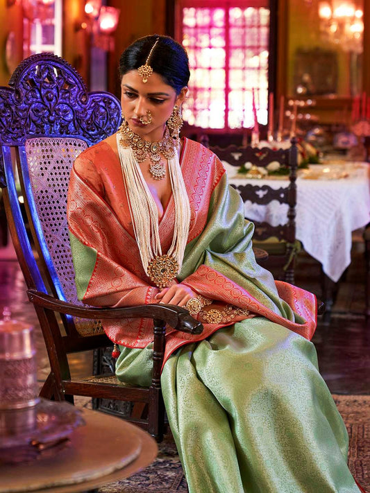 Elegant Green Kanjivaram Banarasi silk saree with Zari woven design for women includes an unstitched blouse piece.