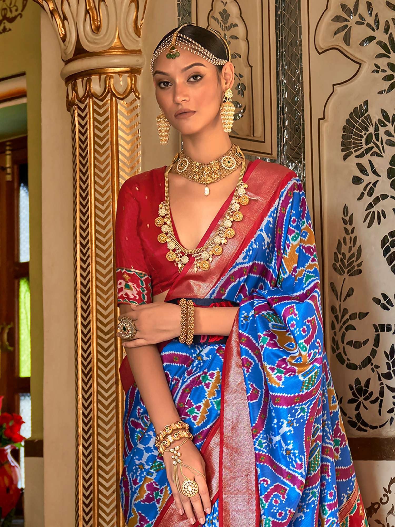 Elevate your style with our Women's Blue Patola Silk Saree. The blend of Ikat and Patola patterns in rich silk exudes timeless elegance. An unstitched blouse is included for a customizable look. Perfect for special occasions.